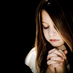 This photo of a young girl saying her prayers was taken by US photographer Chris Watk.